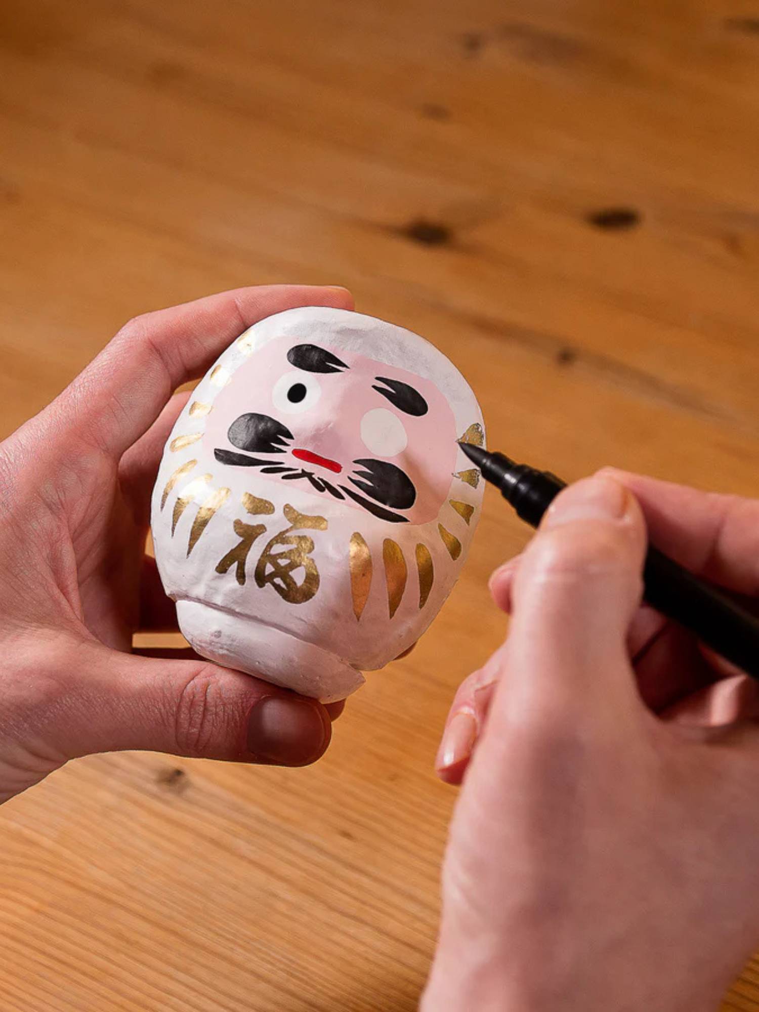 Daruma dockans rituella betydelse